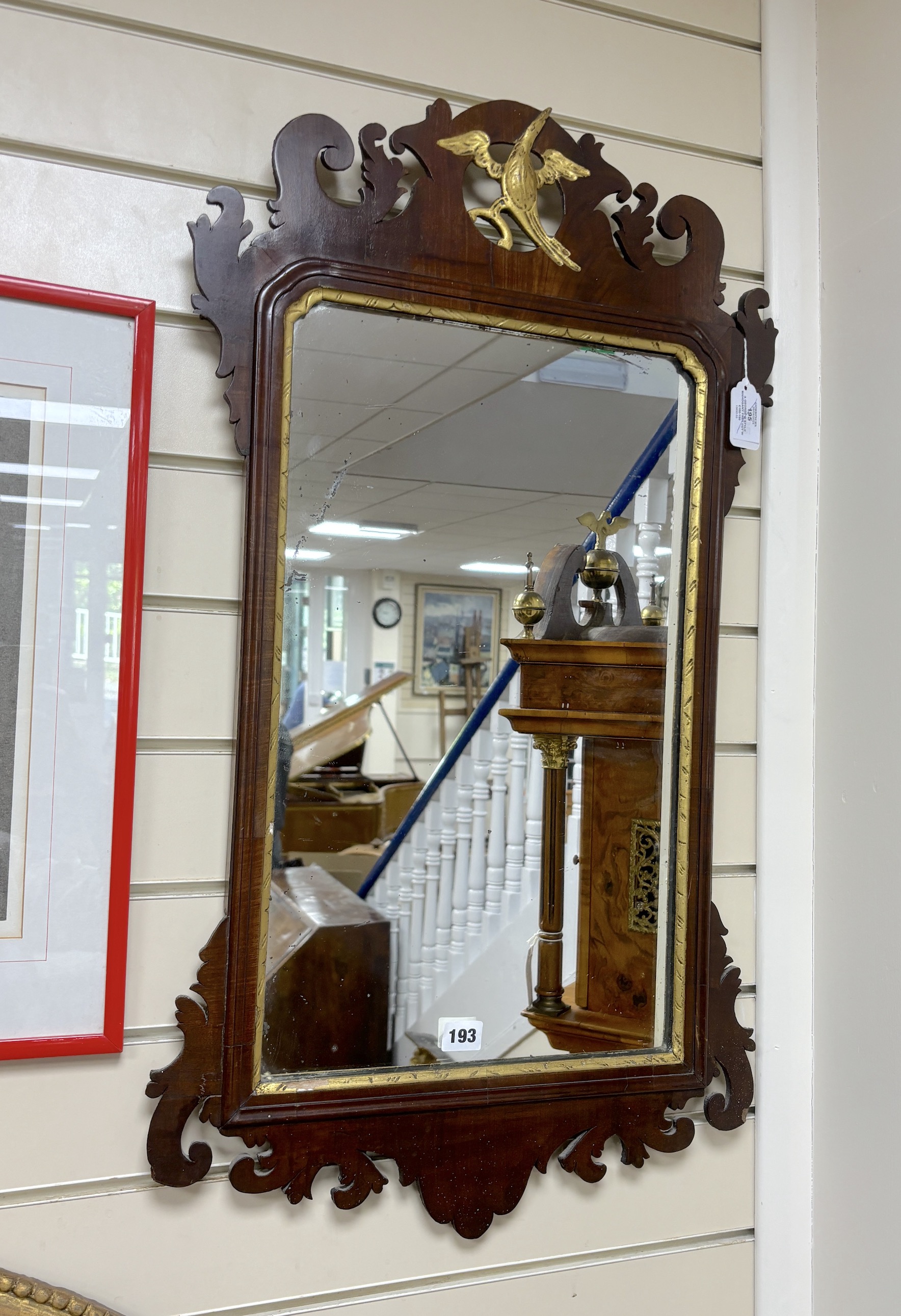 A George III style mahogany fret cut wall mirror, width 47cm, height 86cm